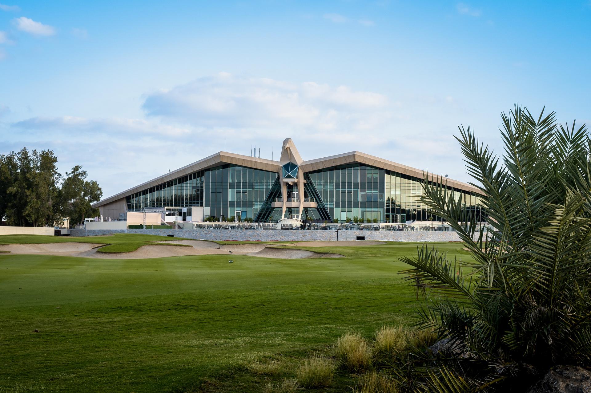 Emirates Golf Club clubhouse at sunset
