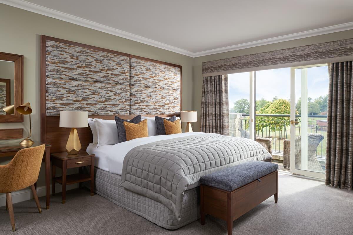 Modern bedroom with balcony overlooking the greens