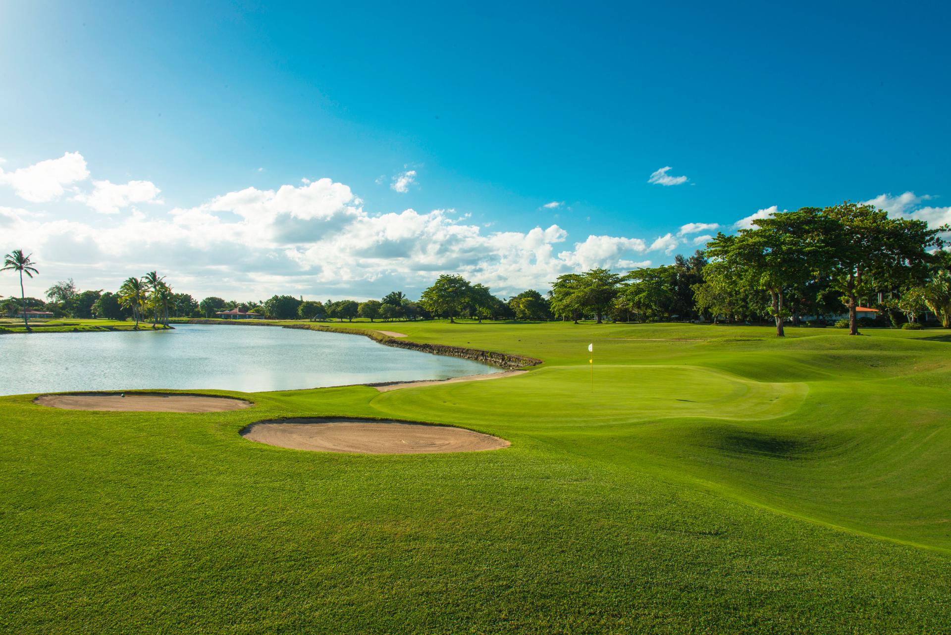 A winding fairway leading to a smooth coastal green