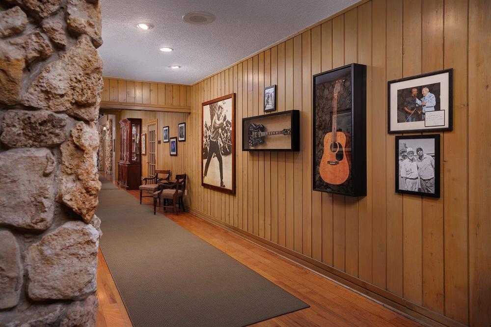 Clubhouse corridor with guitar and memorabilia hanging on the wall