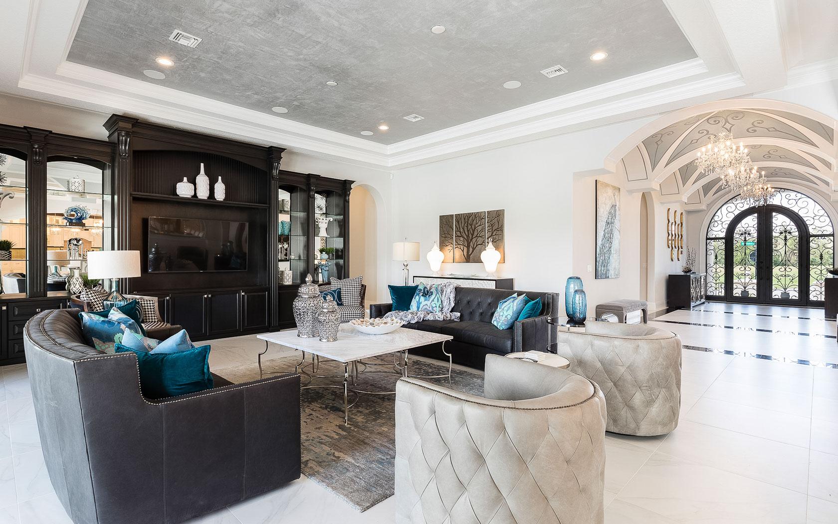 A grand front entrance with chandlers leading to the living room at the Reunion Resort