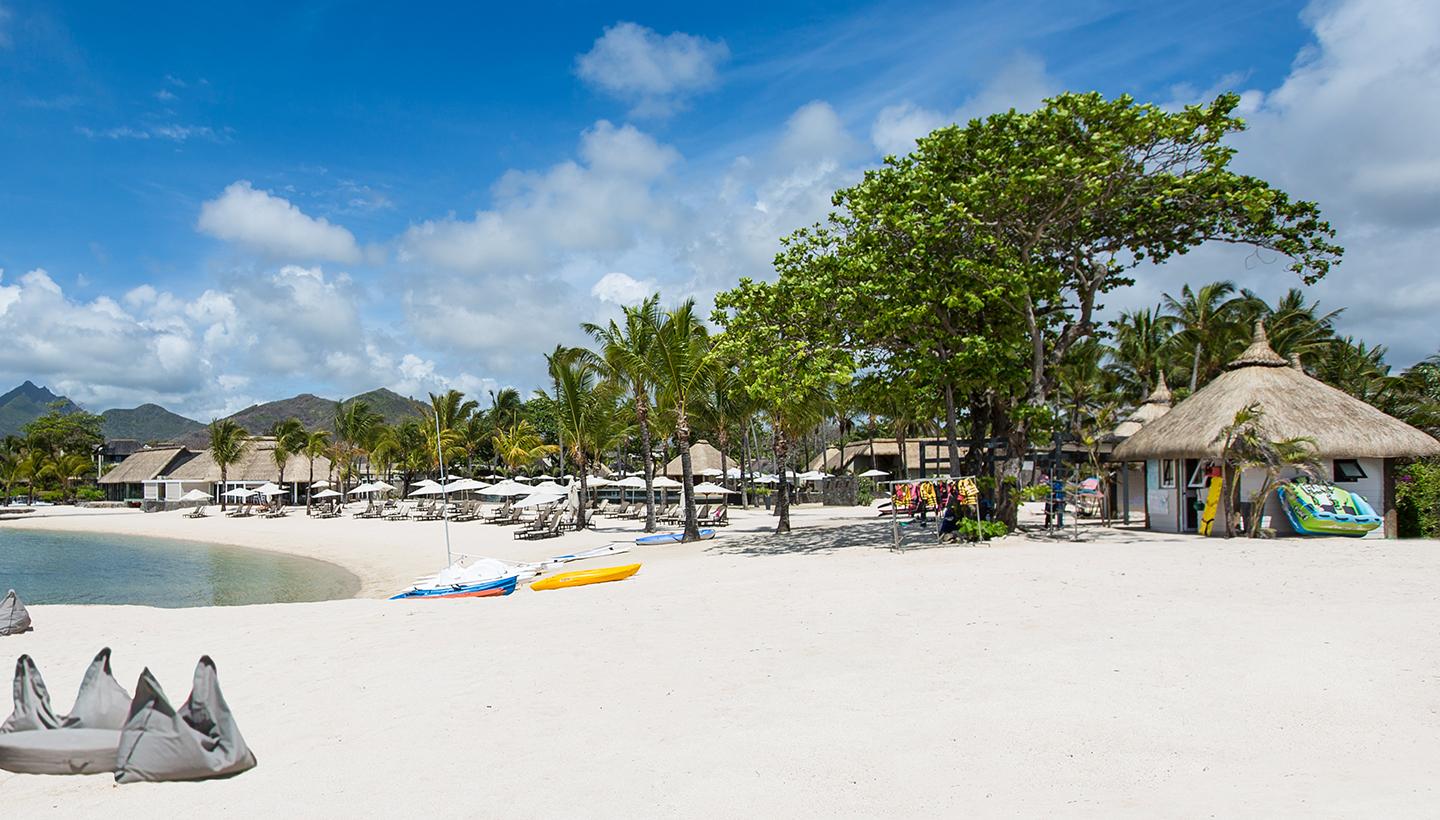 The Anahita Golf & Spa Resort's on sight beach nestled with palm trees