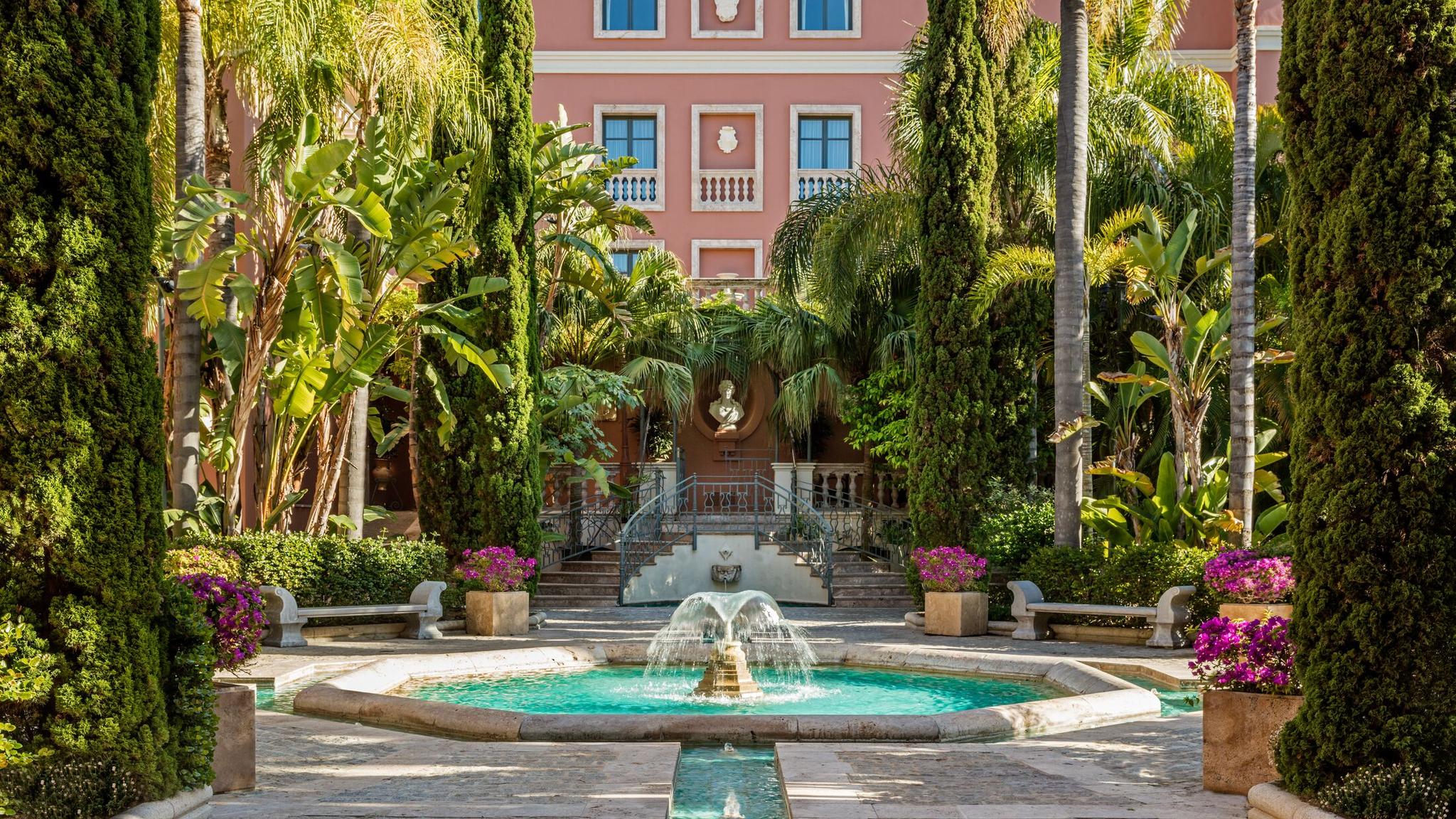 Front entrance with fountain and trees