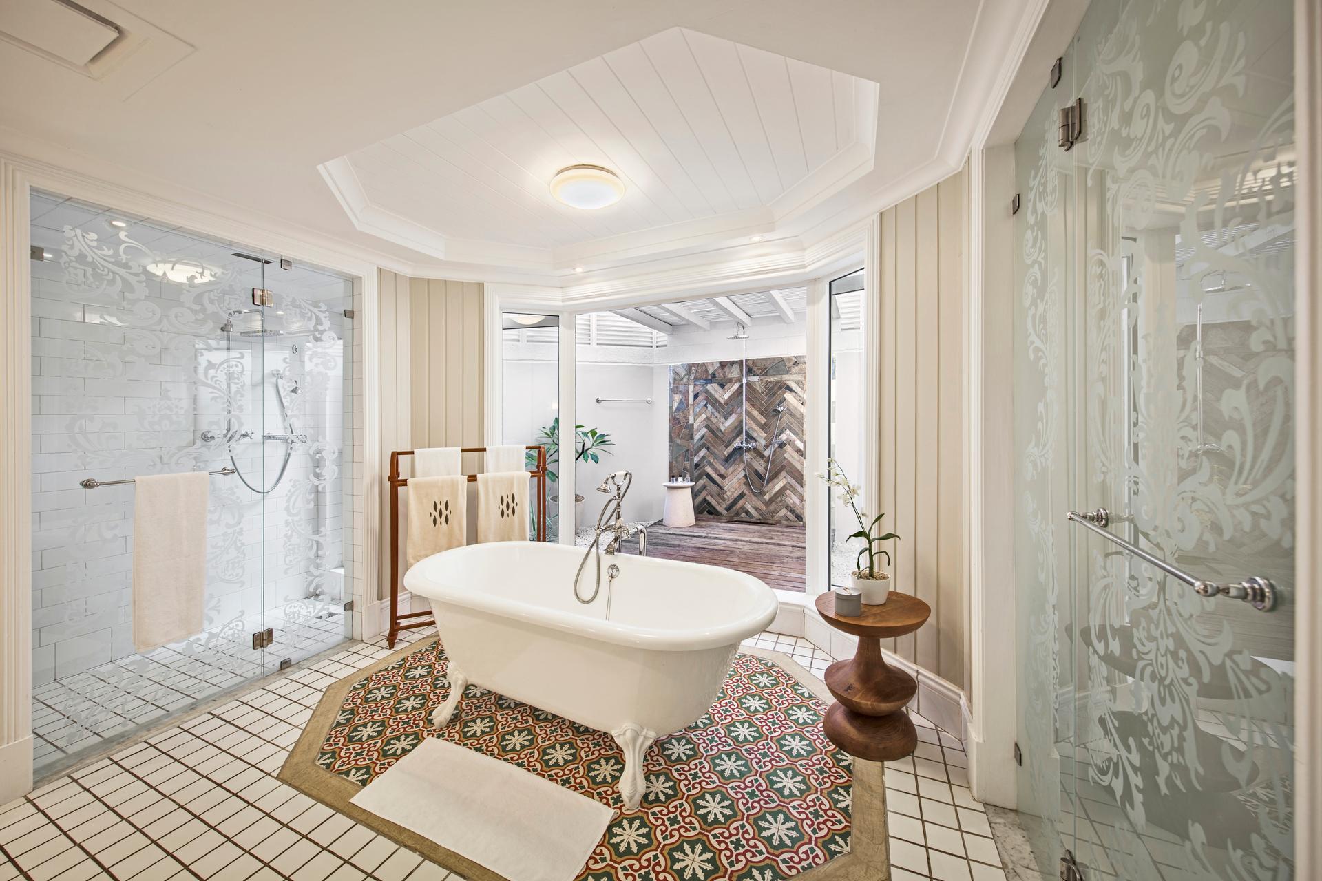 A luxurious bathroom at the resort with the option of a bath or three separate showers