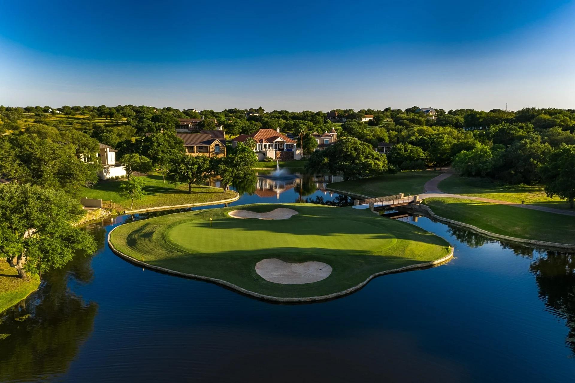 An island green surrounded by sparkling water highlights the resort’s scenic golf course.