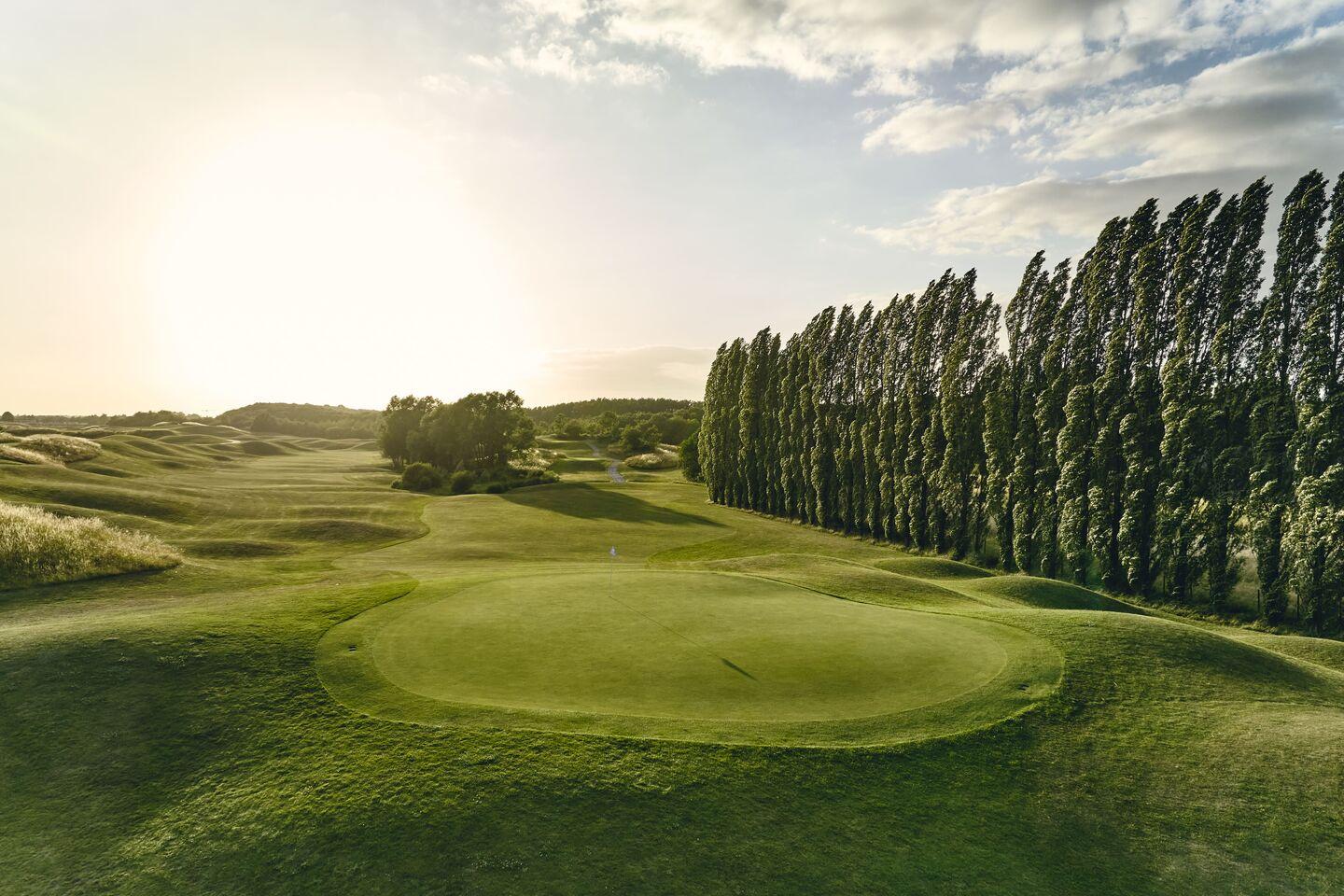 Narrow fairway leading up to the green
