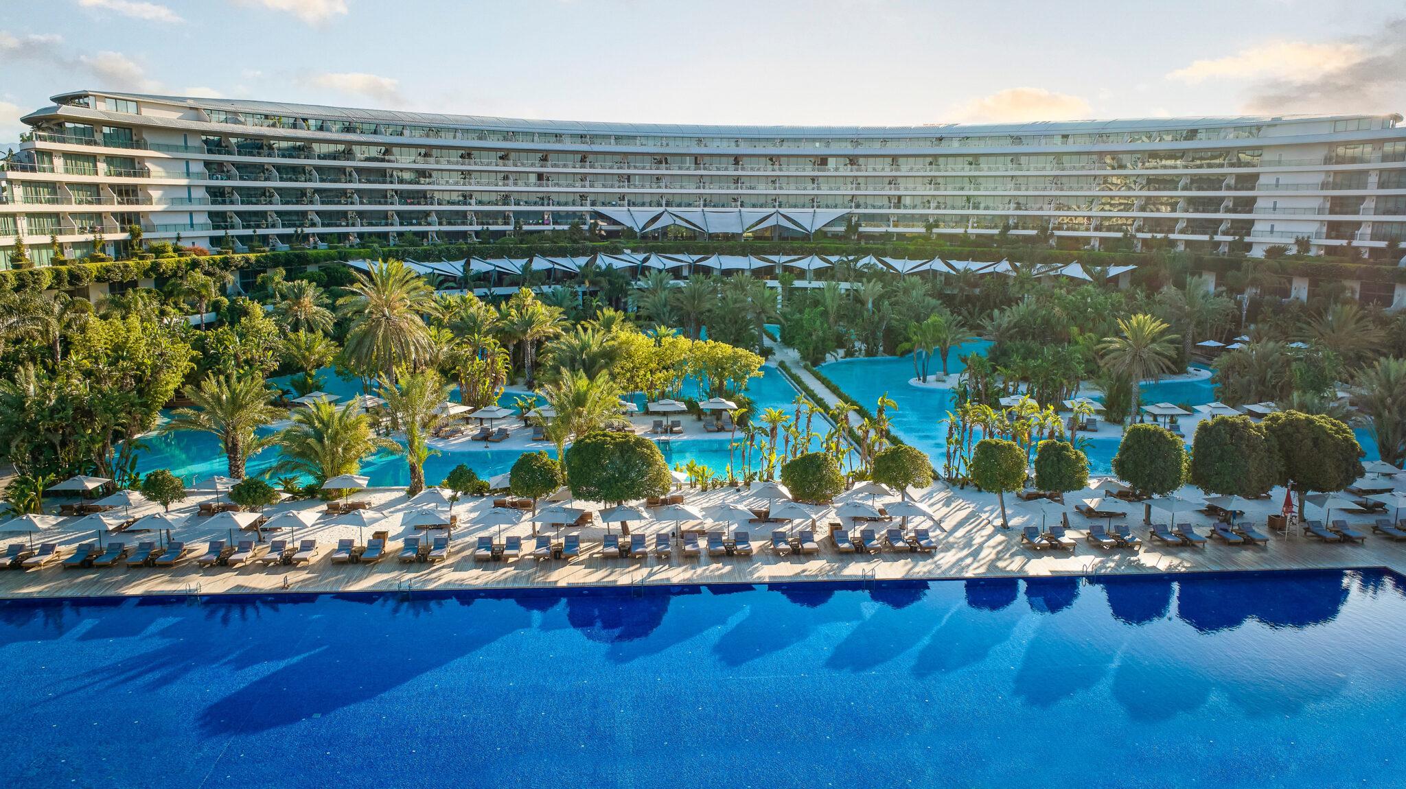 Outdoor swimming pool area overlooked by the hotel