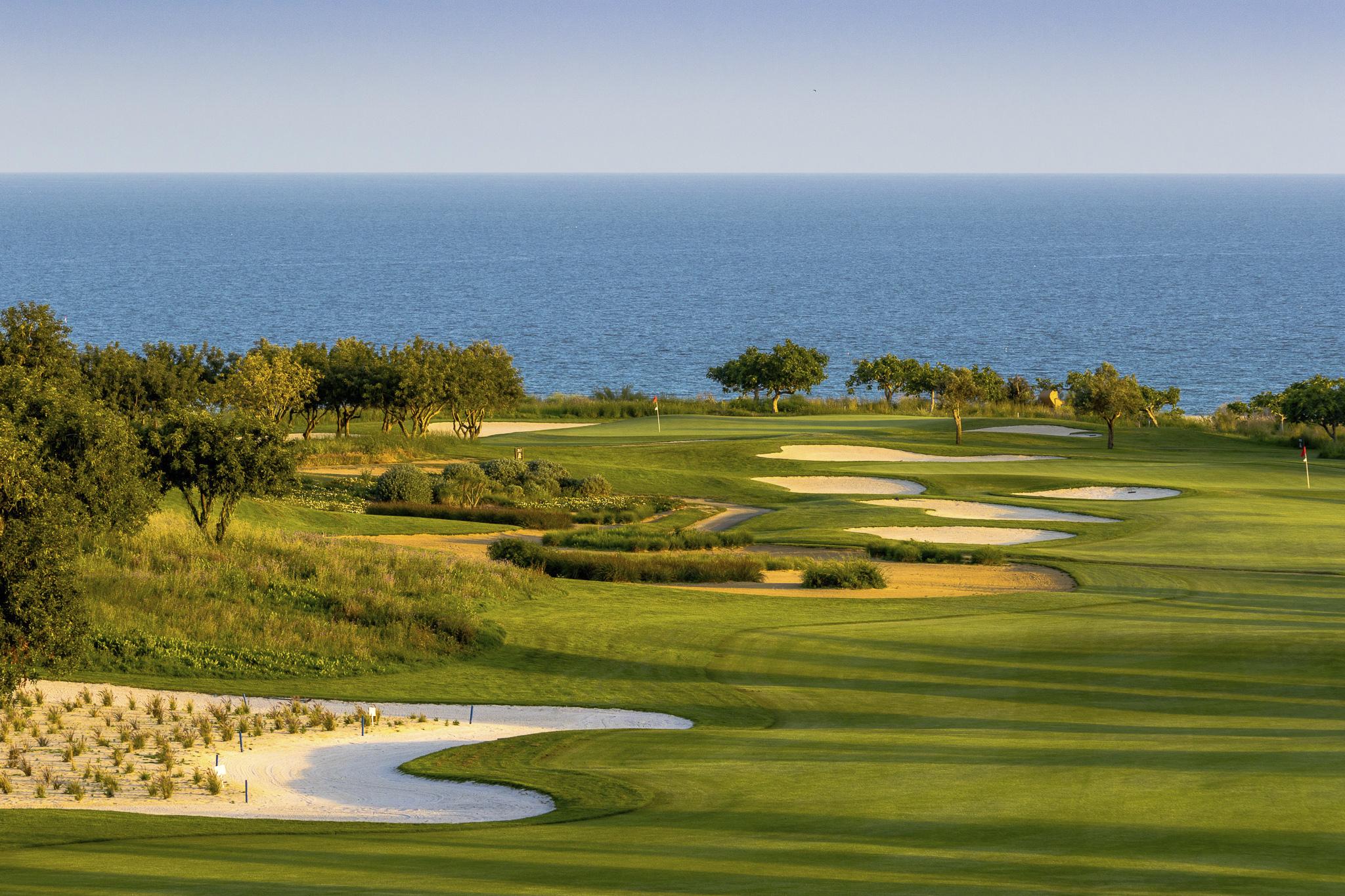 Winding fairway interspersed by bunkers