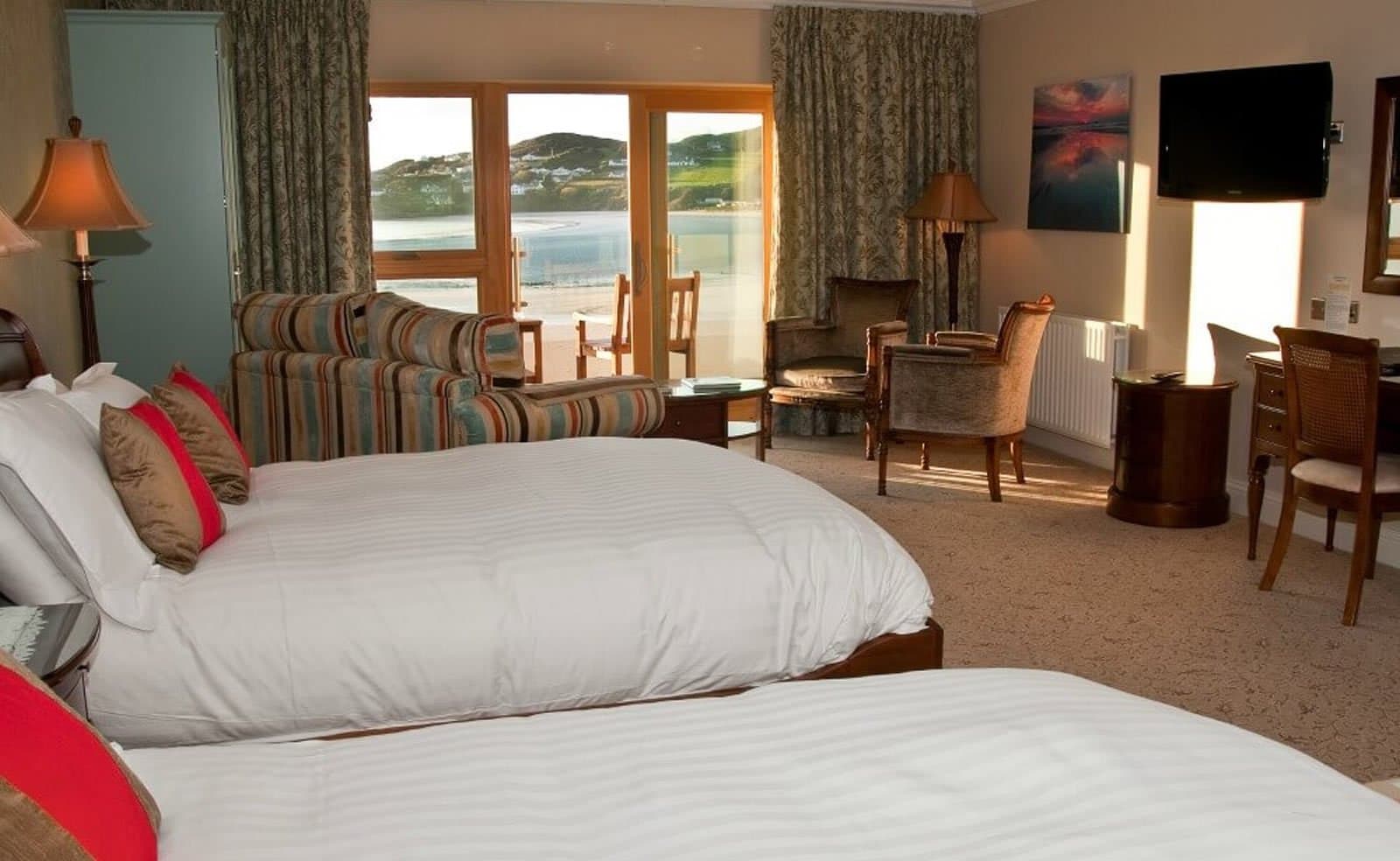 Double bed room at the Rosapenna Resort with a old fashioned look and a beautiful balcony overlooking the beach and sea