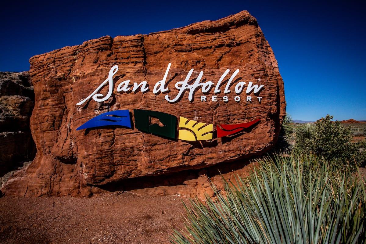 A stone with the Sand Hollow Resort logo printed onto it
