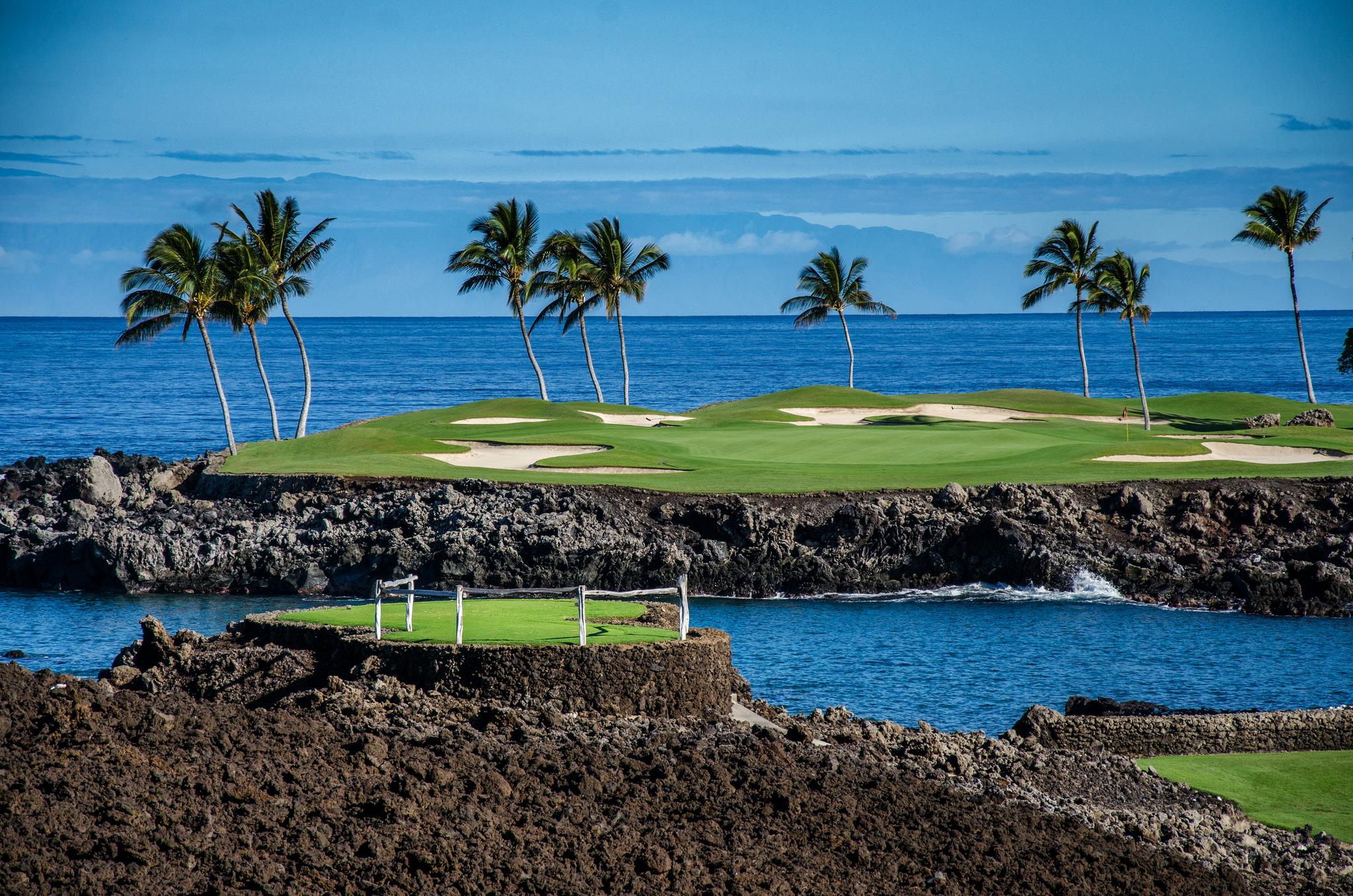 View of a green surrounded by water