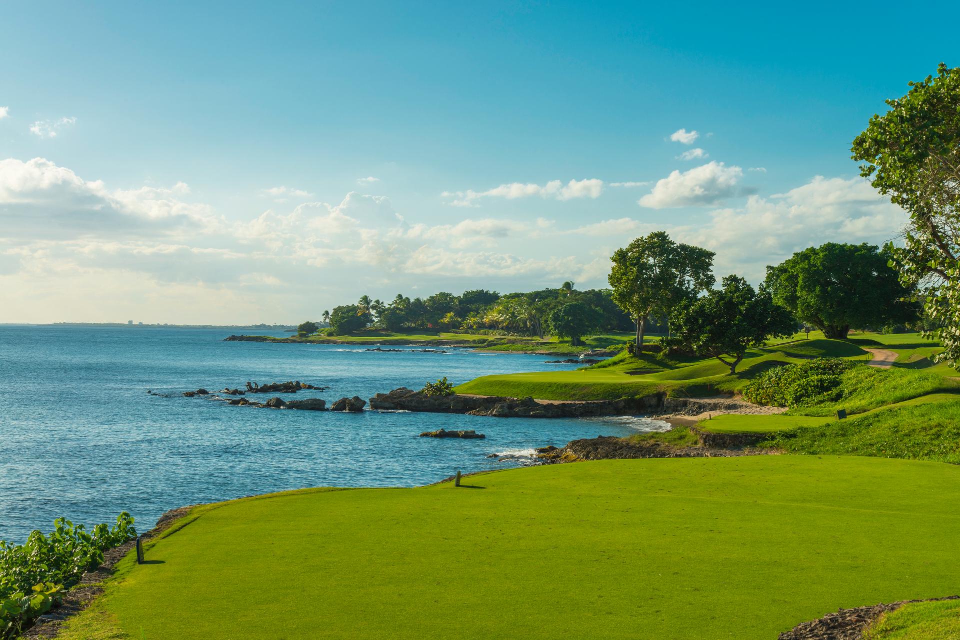 A smooth green with coastal views