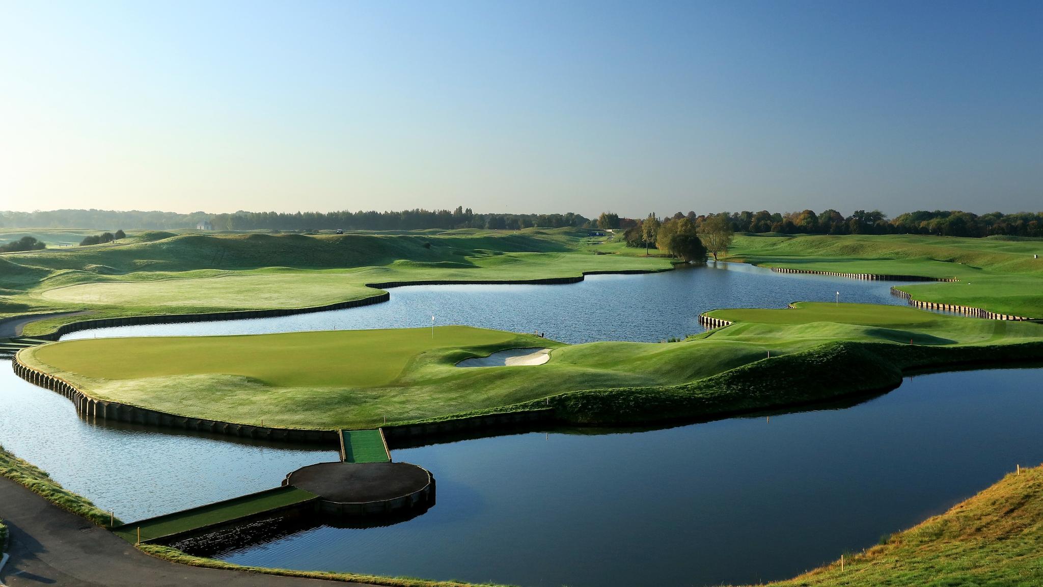 Panoramic view of an island green surrounded by a large water hazard