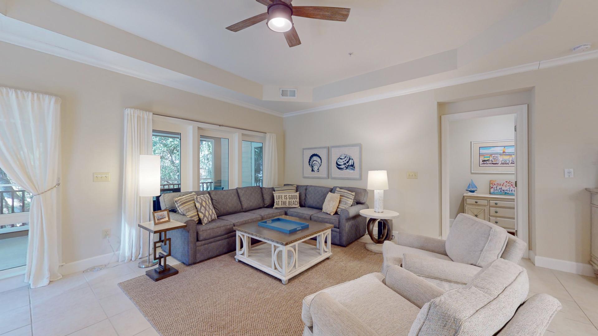 Living room as part of a suite at the hotel with sofa areas and balcony views
