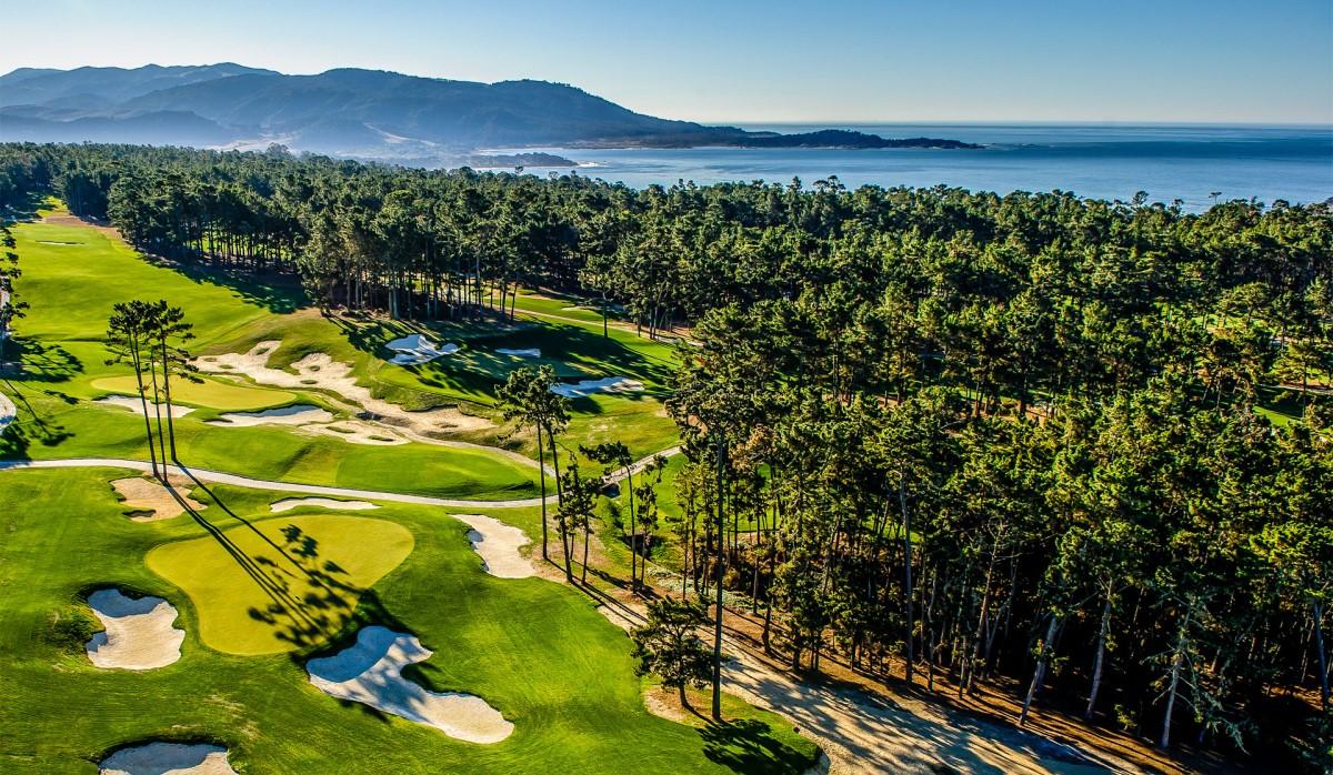 Birdseye view of a straight fairway leading to a smooth green scattered with sand bunkers