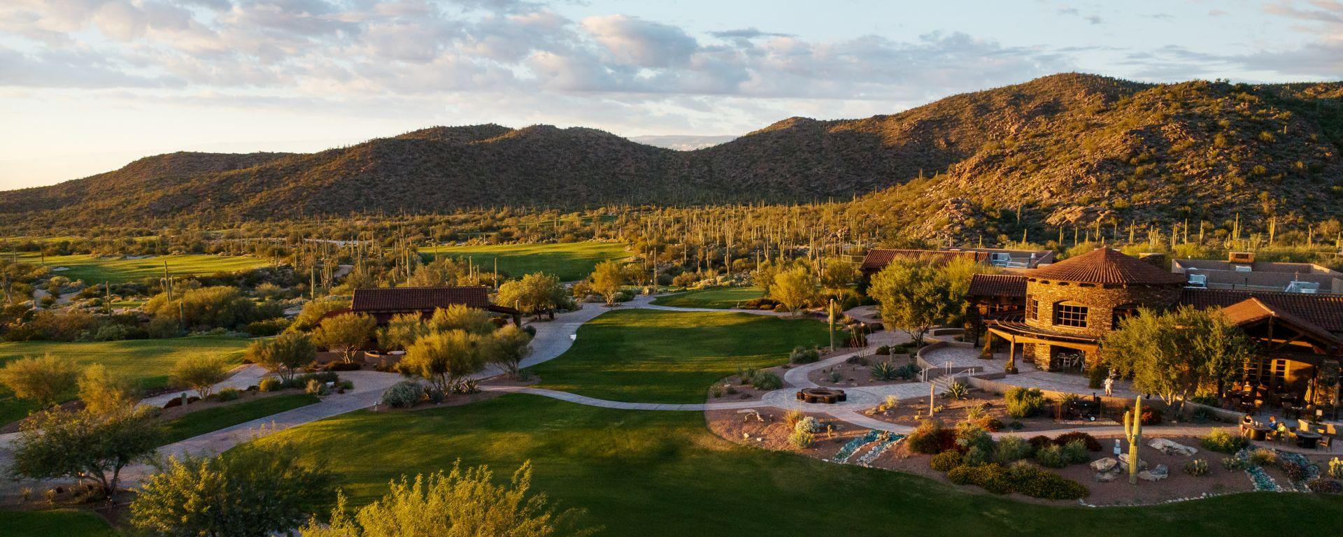 Panoramic view of a wide fairway surrounded by a mature rough