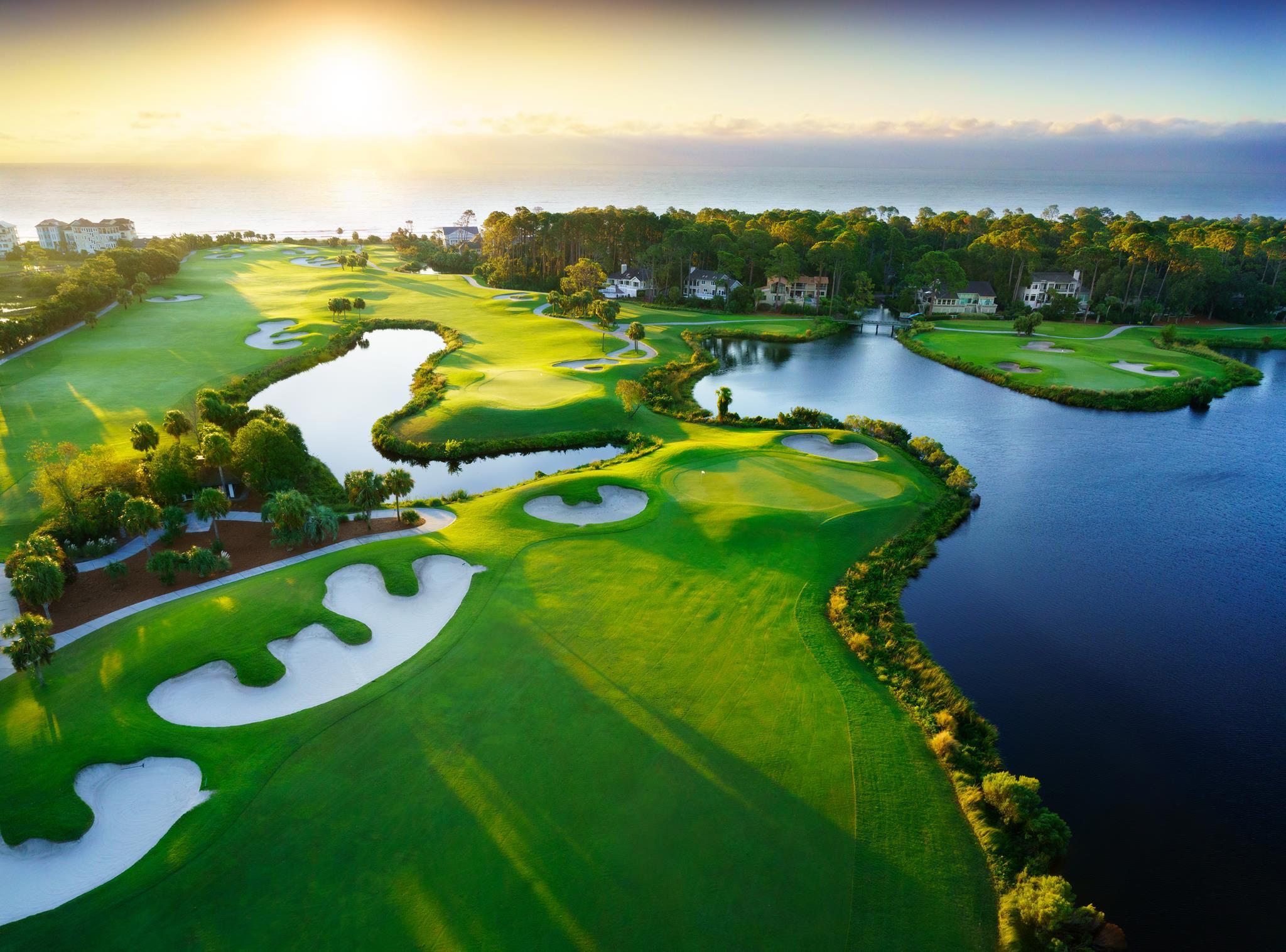 Sun setting over the Palmetto Robert Trent Jones Course which is scattered with sand bunkers