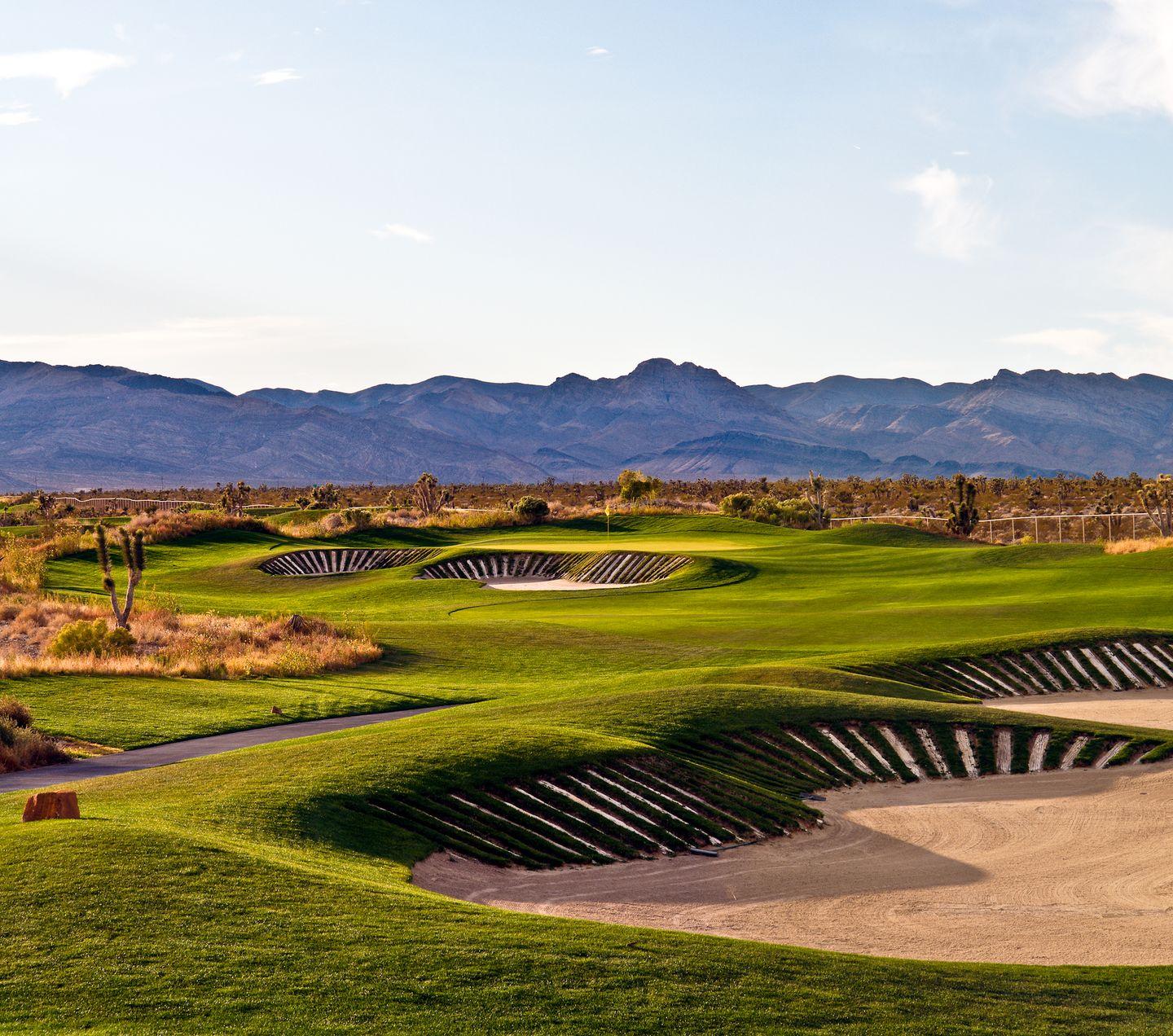 Deep sand bunkers surrounding a smooth green on the Sun Mountain Course