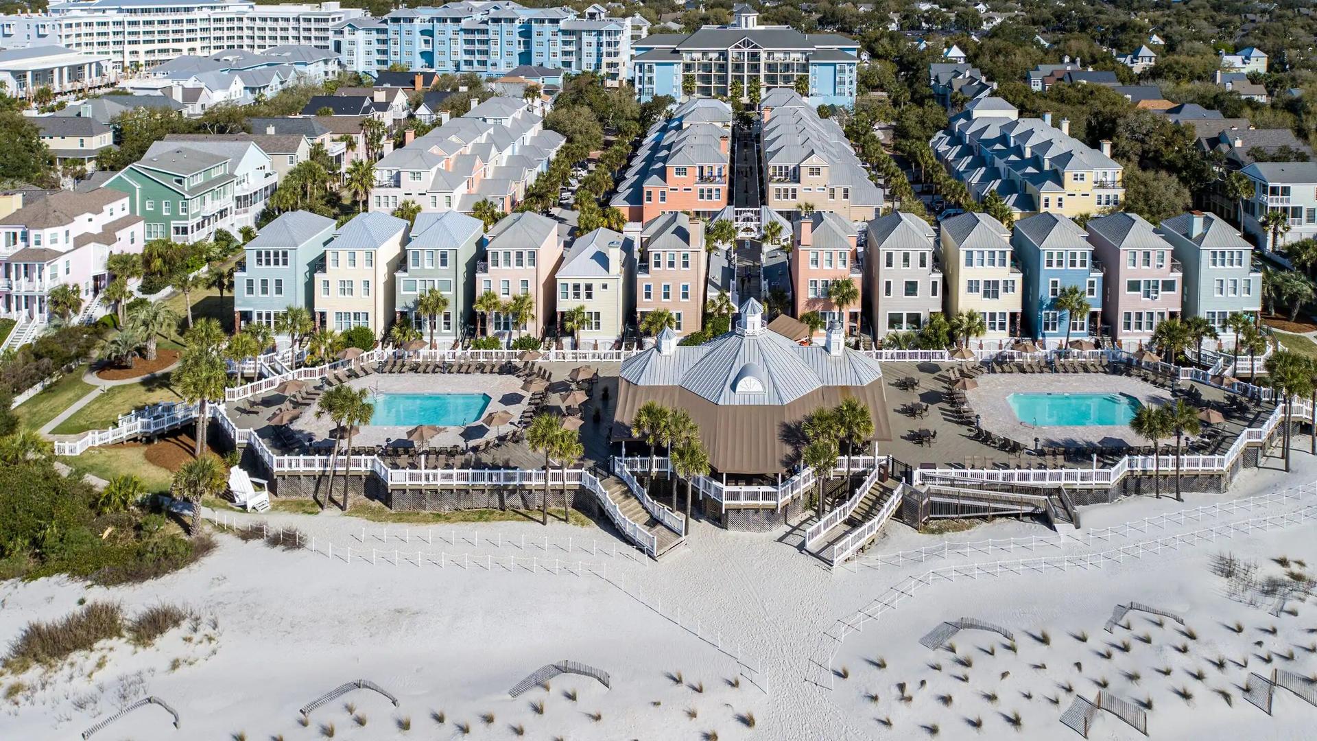 Birdeye view of the Wild Dunes Resort with two swimming pools leading to the beach