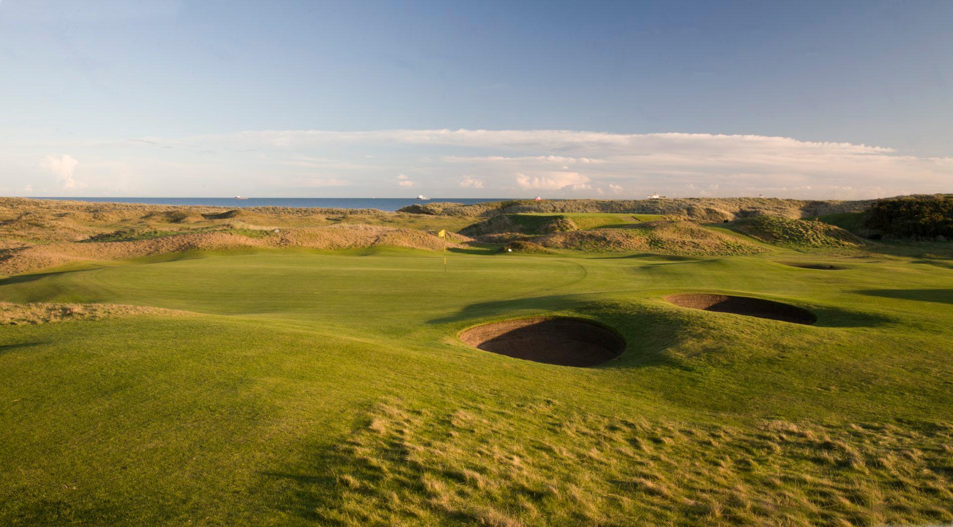 Fast greens at the Balgownie course surrounded by sand bunkers and a lovely view of the sea