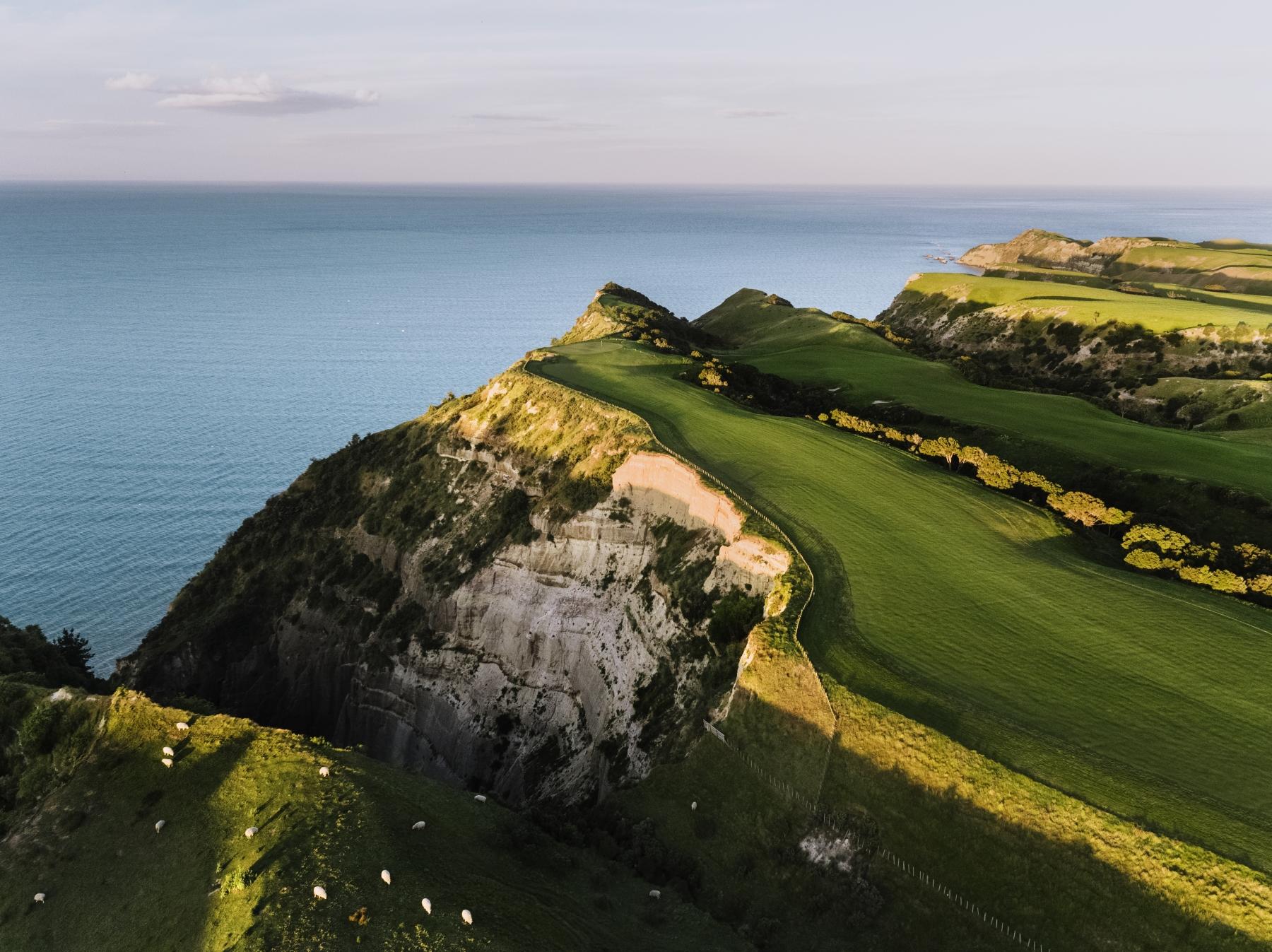 Aerial view of wide fairways with coastal views