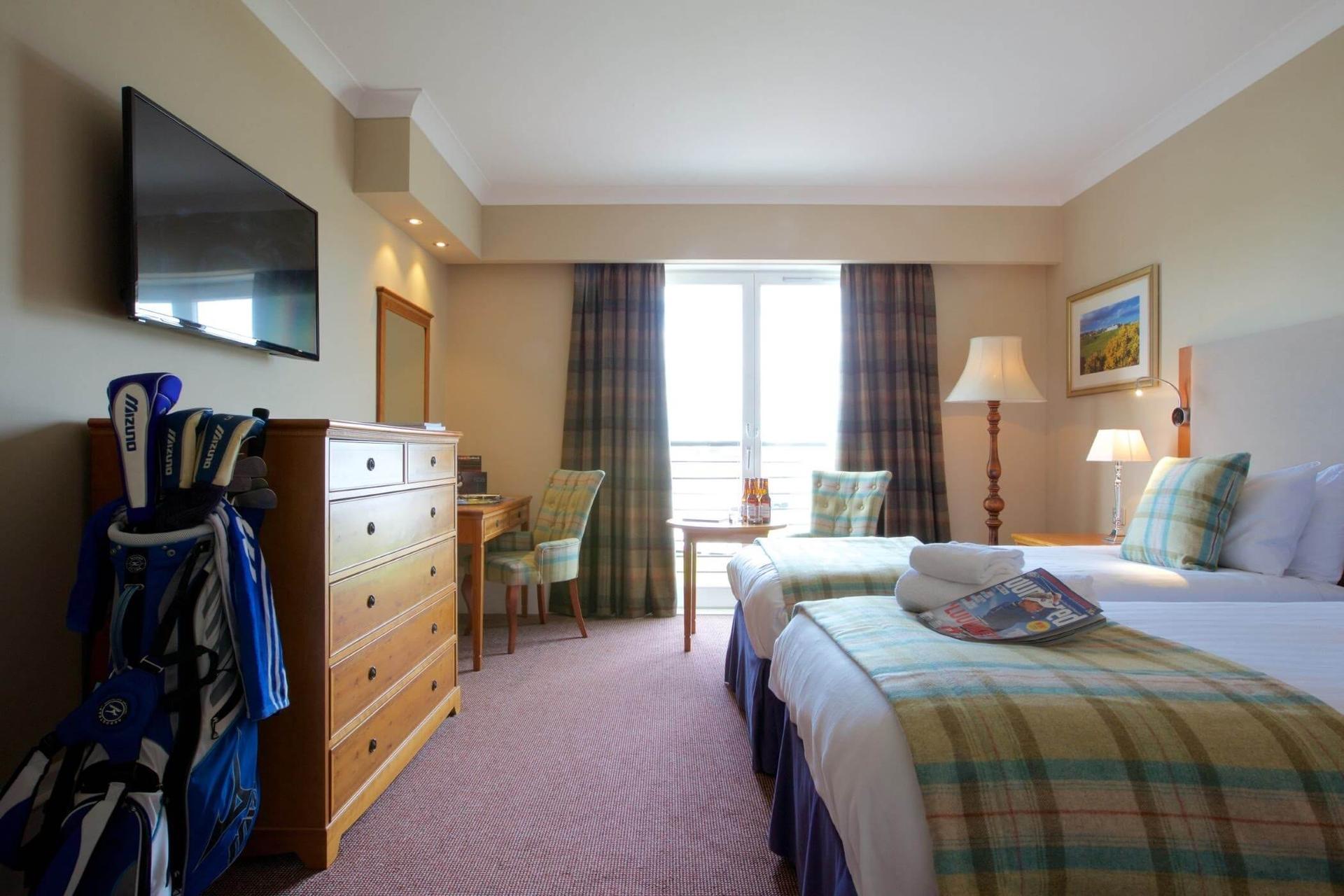 Twin bedroom at the Carnoustie Resort with a rustic design and smart TV