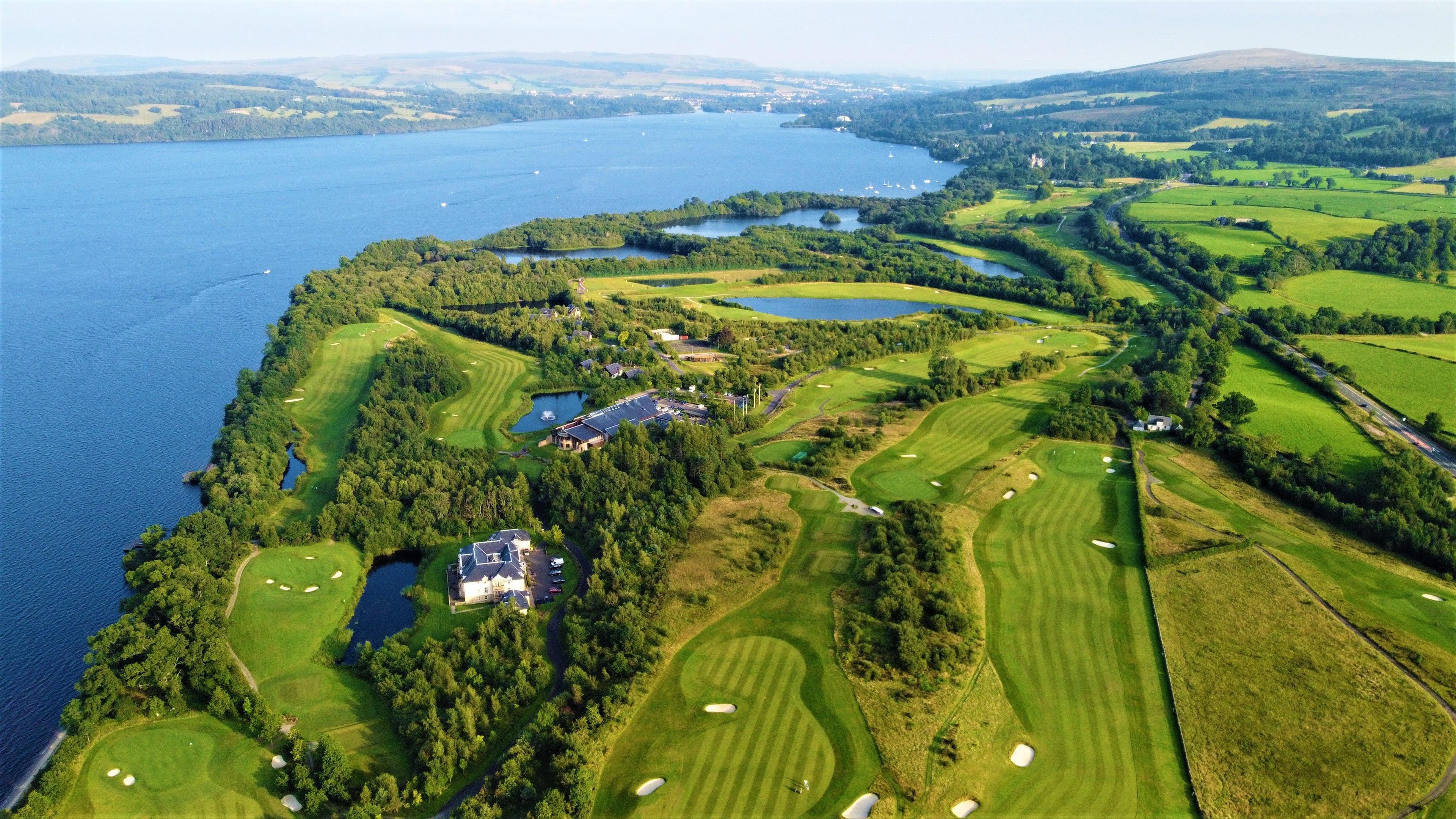 Aerial view of The Carrrick Course showing its winding fairways, maintained greens and sea views