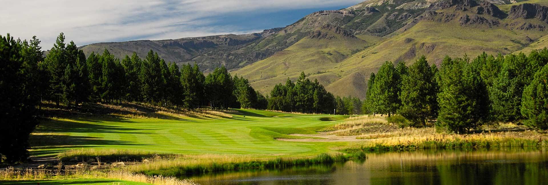 A winding fairway with mountain views