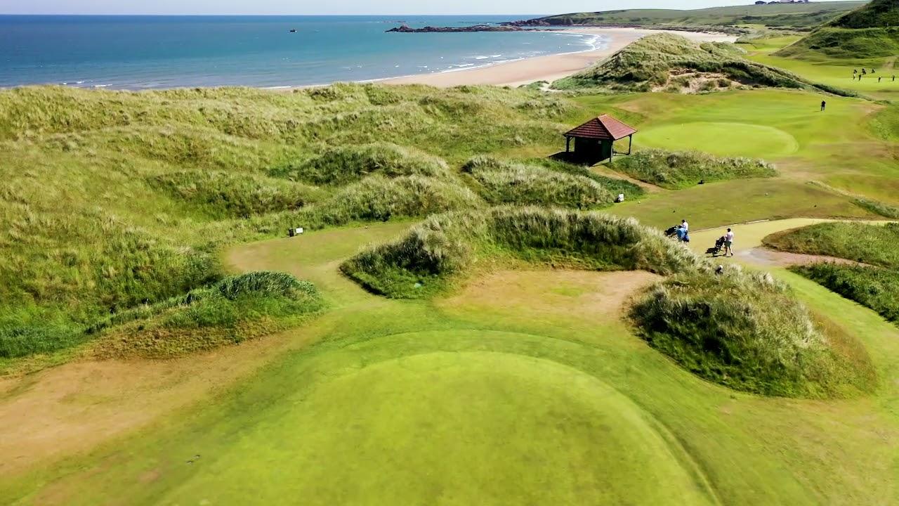 Birds-eye view of the Cruden Bay Course with its hilly landscape surrounding the green and views of the sea