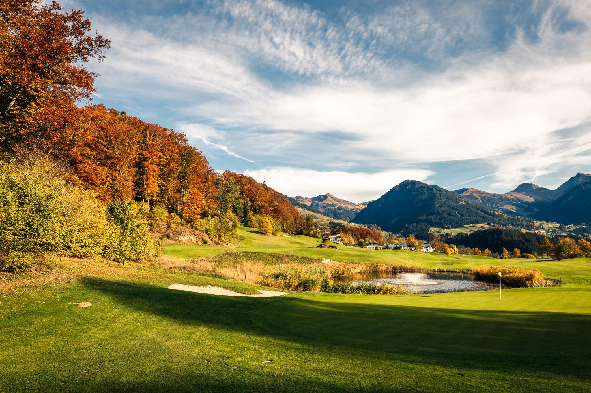 A water hazard with a fountain strategically placed next to a green