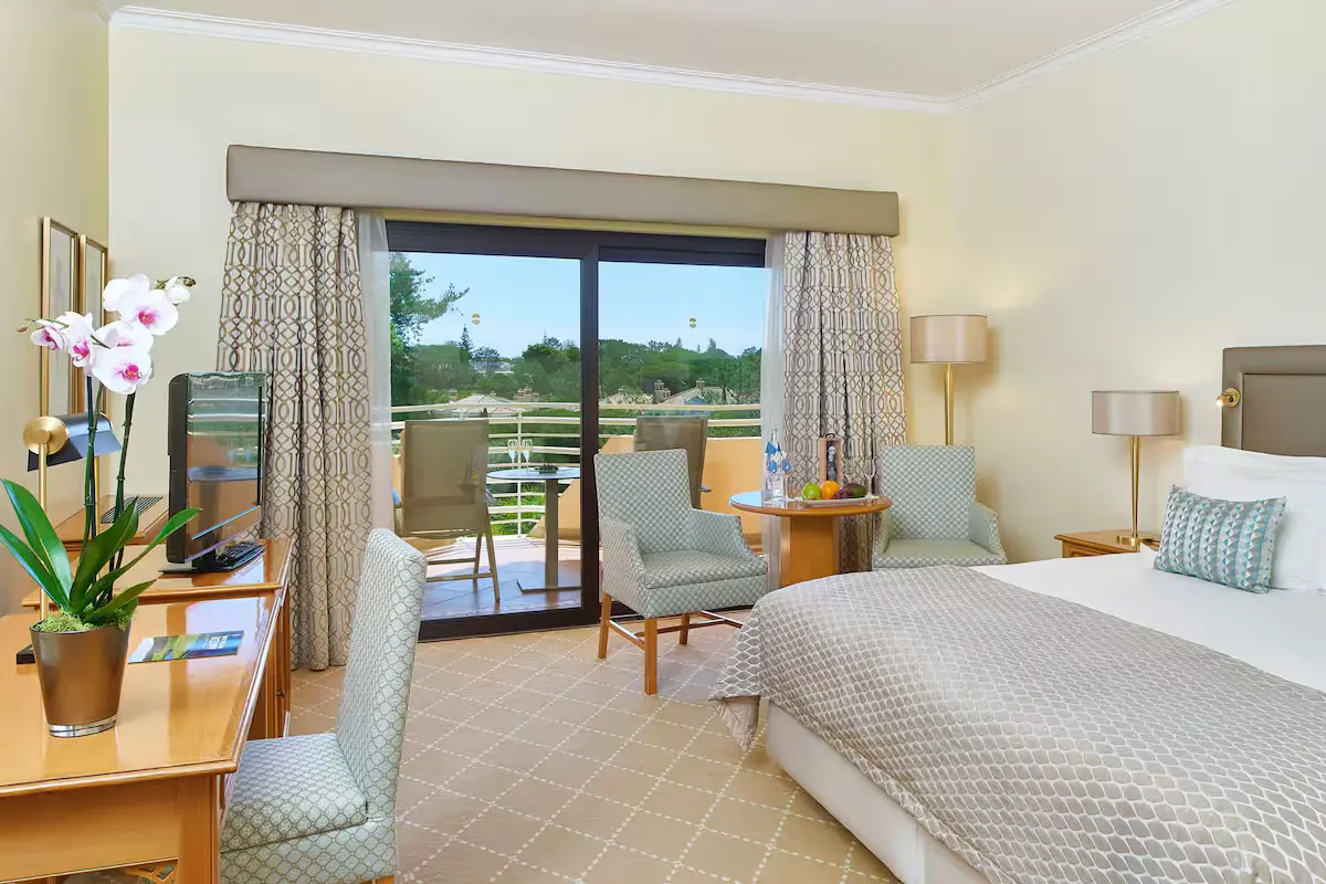 Double bed and balcony in a Double Room