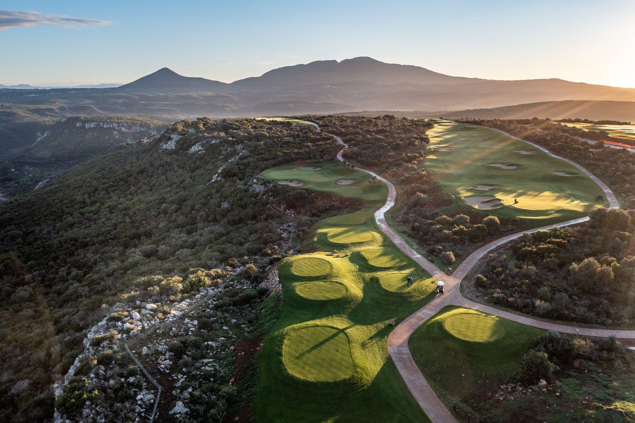 Birdseye view of the International Olympic Academy Course with mountain views in the distance