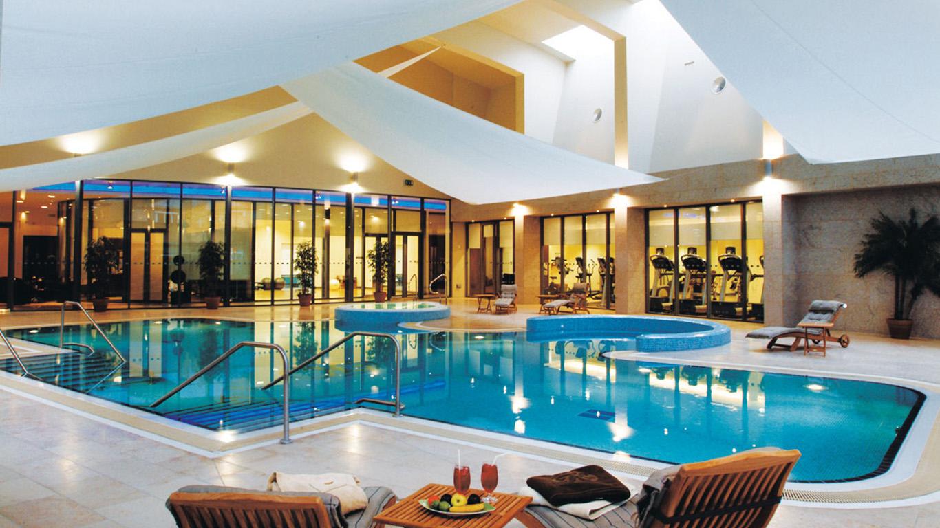 Elegant aerial view of the K Club, surrounded by pristine fairways and lush greenery.