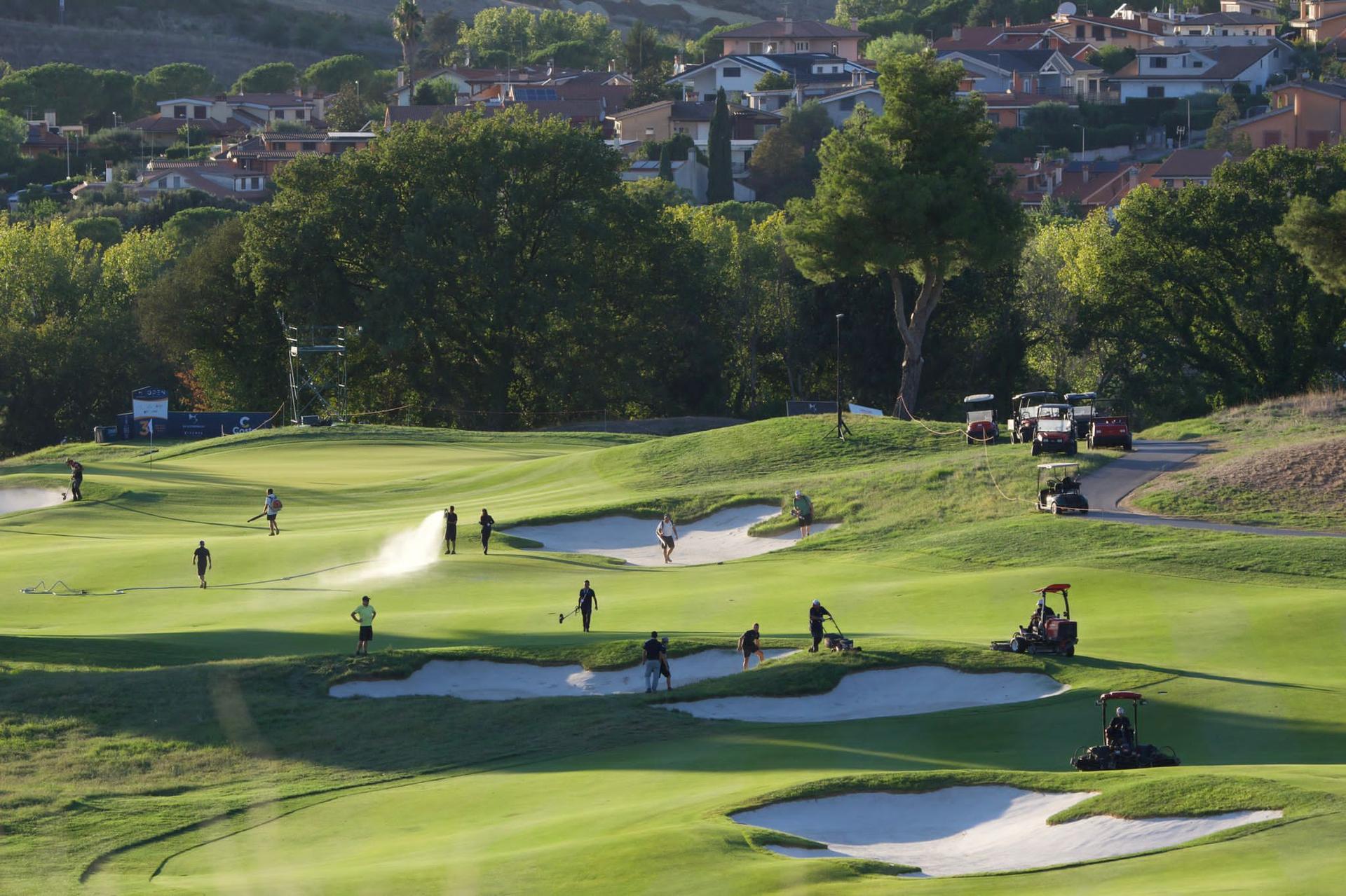 Employees maintaining the Marco Simone Golf & Country Club course