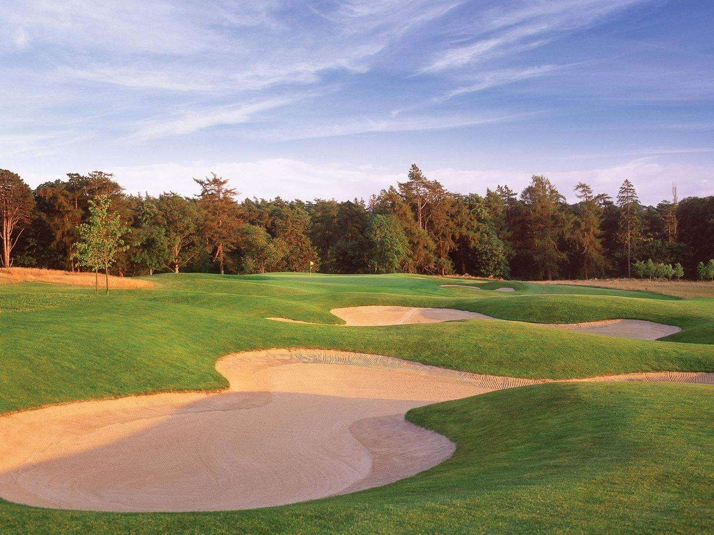 Deep bunkers guarding a challenging green approach.