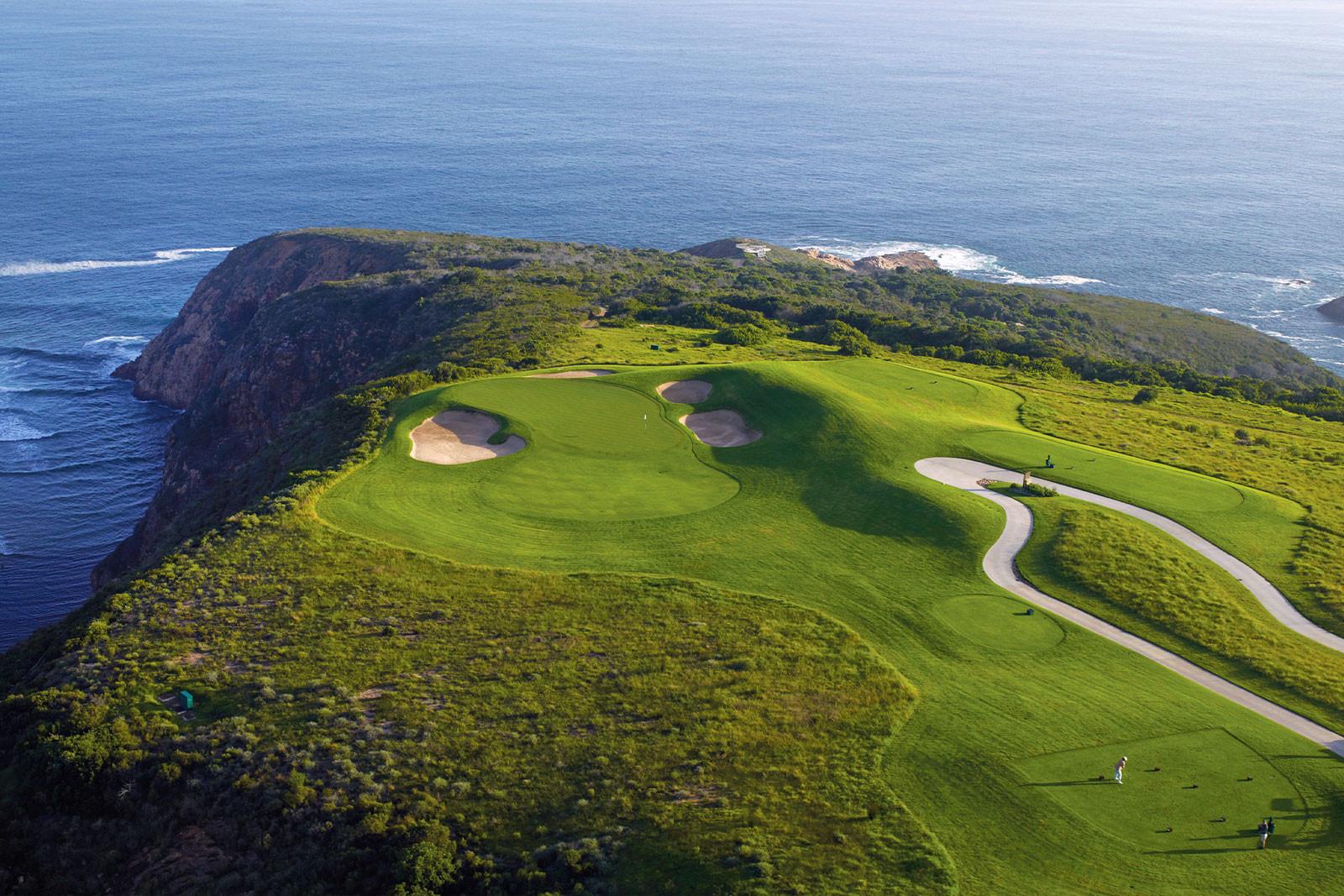 A stunning cliffside golf hole overlooking the vast ocean.