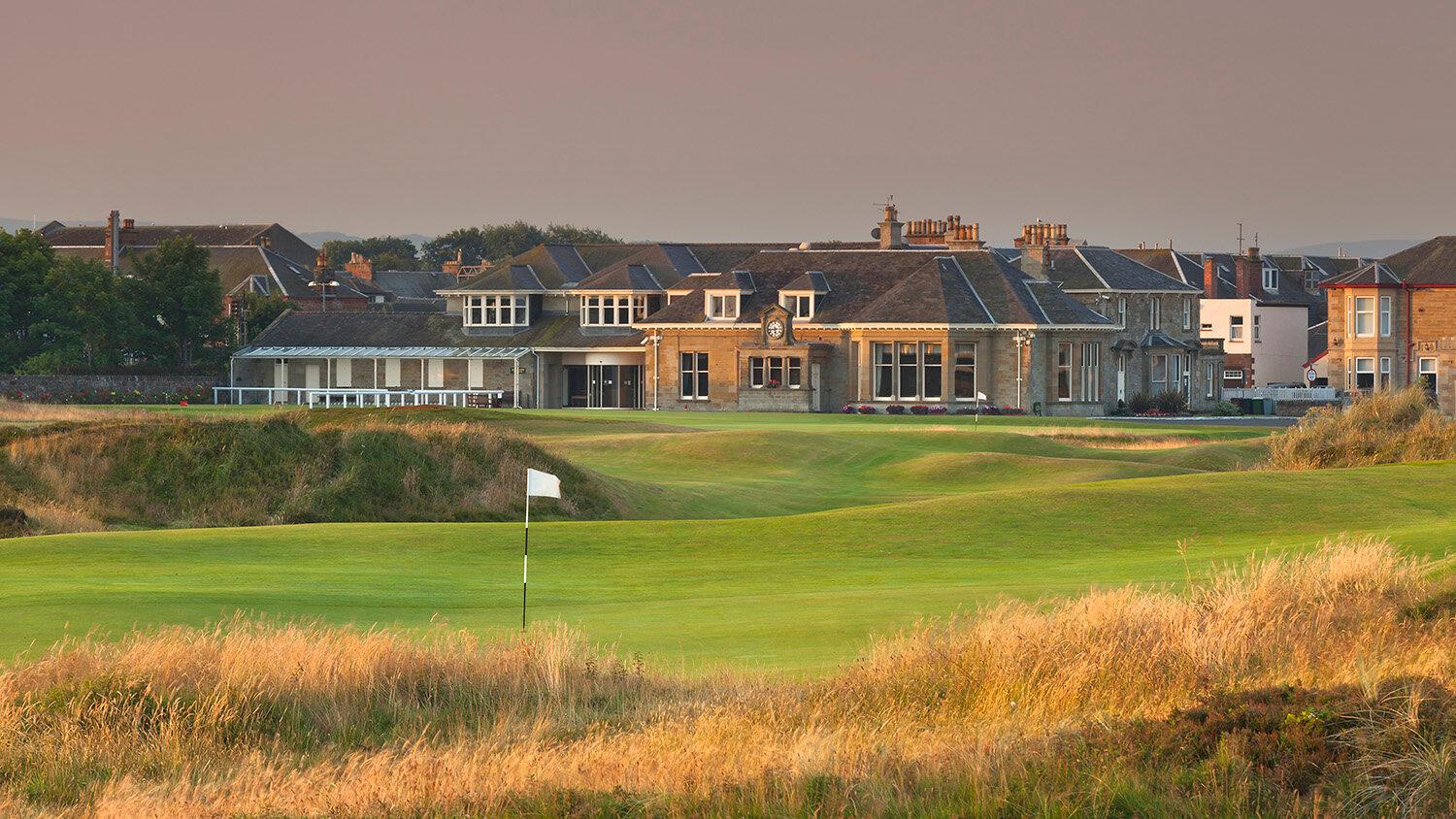 Prestwick Golf Club’s classic clubhouse surrounded by charming village buildings.