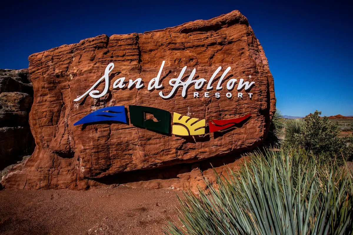 A stone with the Sand Hollow Resort logo printed onto it