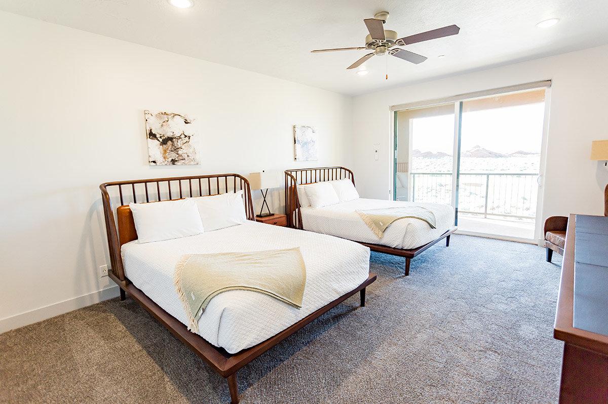 Twin double bed room at the Sand Hollow Resort with balcony views of the distant mountain