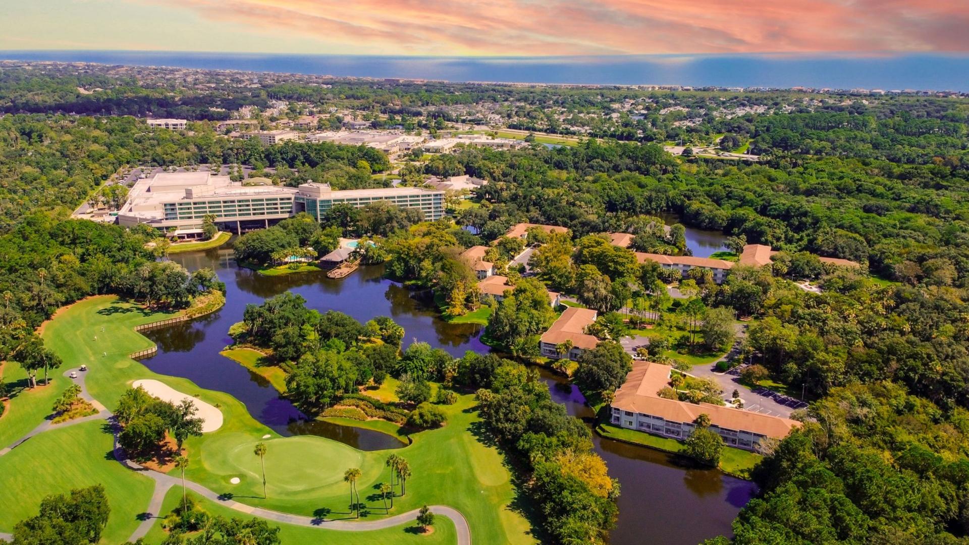 Overhead view of the course with a large water hazard in the centre