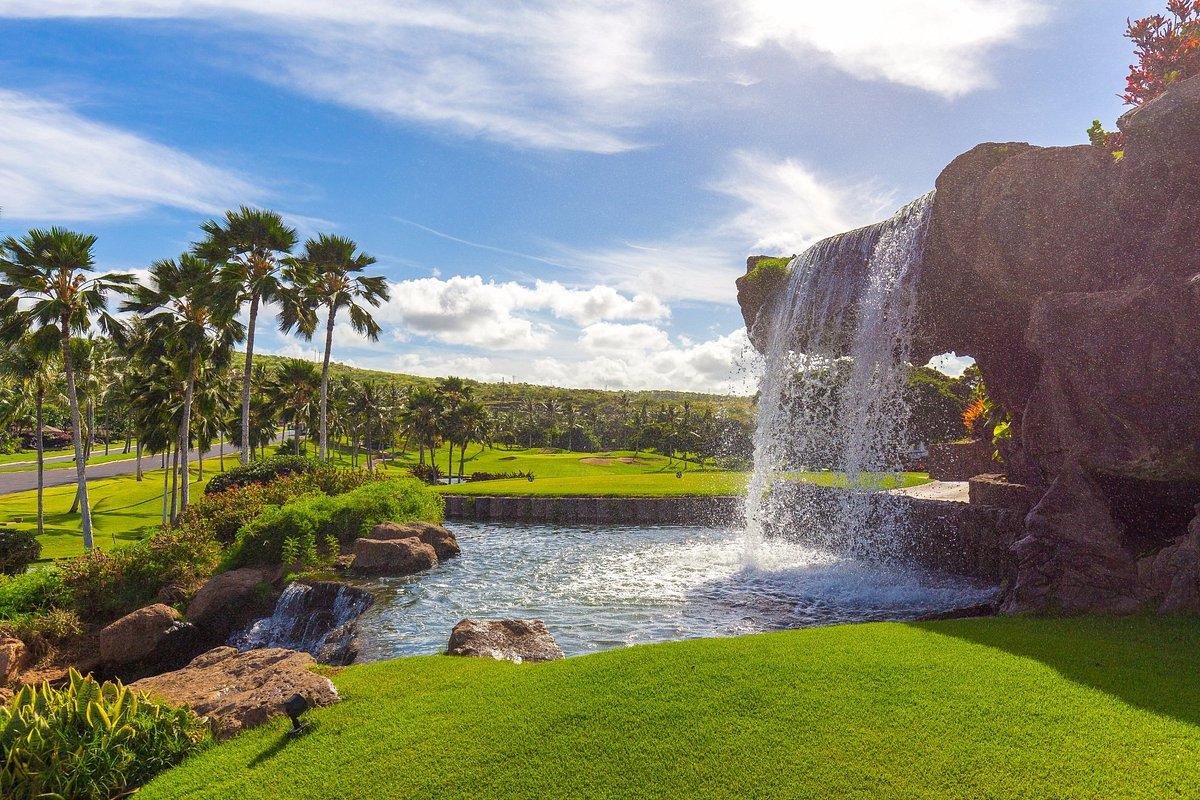 Waterfall in front of a green