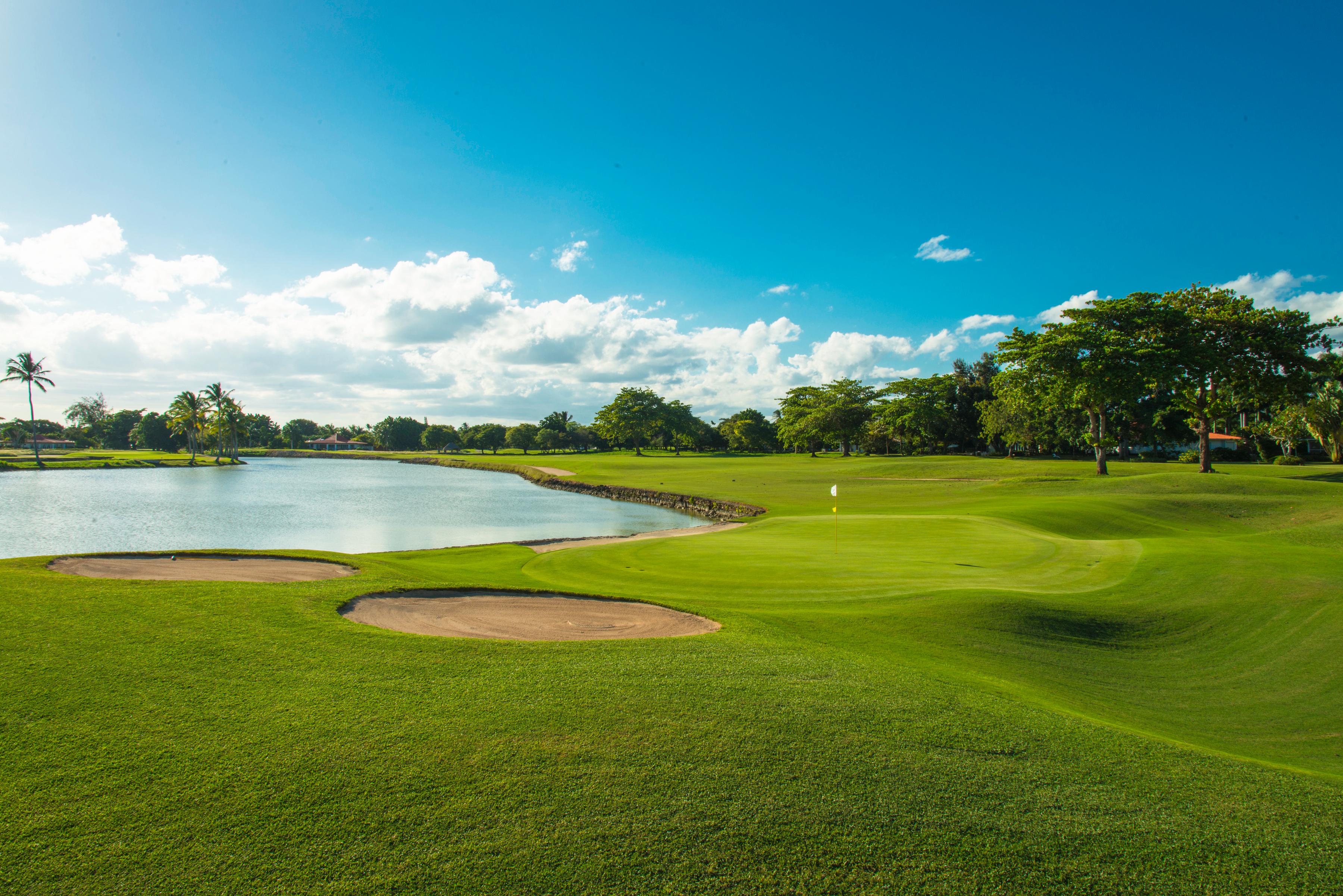 A winding fairway leading to a smooth coastal green