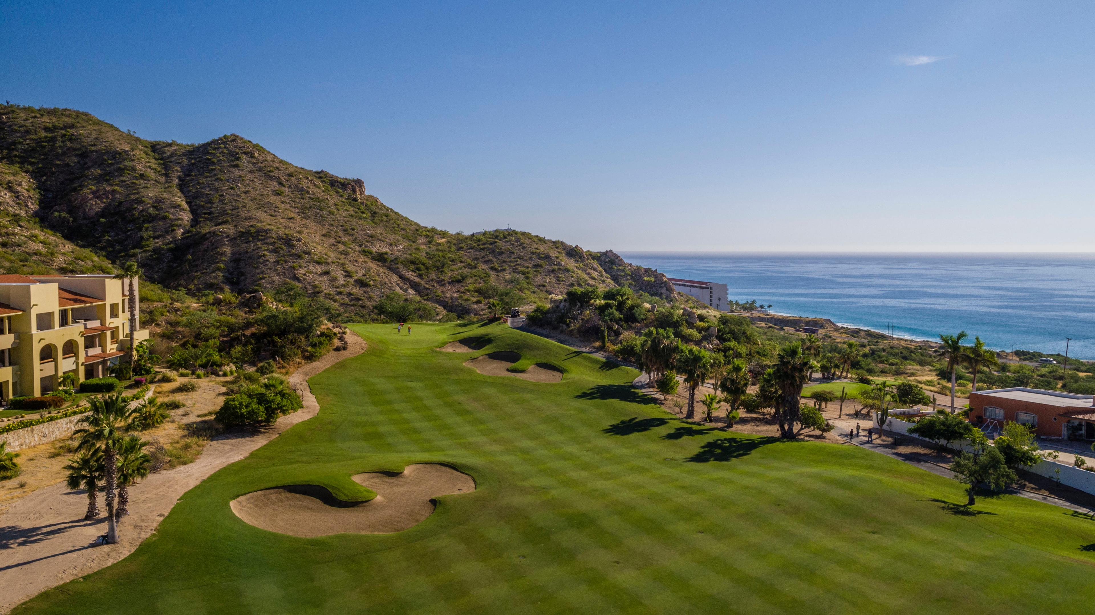 Overhead view of a well maintained fairway nestled with sand bunkers